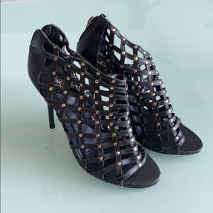 Caged black leather high heels
